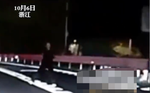 女子疑与家人争执站过路车前哭泣 拍摄者：要吵架不要害别人